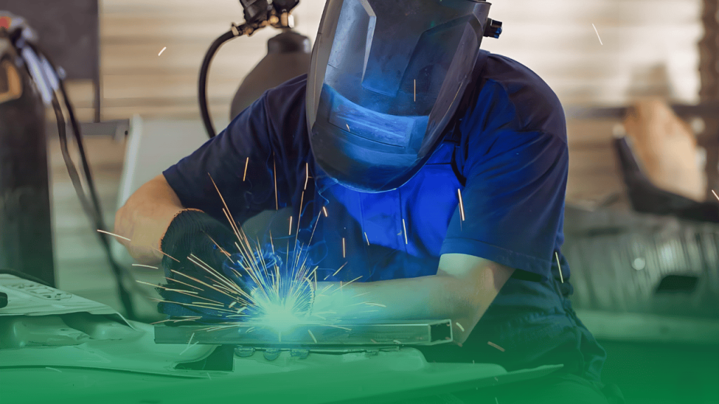 Welder performing MIG welding to join sheet metal parts into a strong assembly.