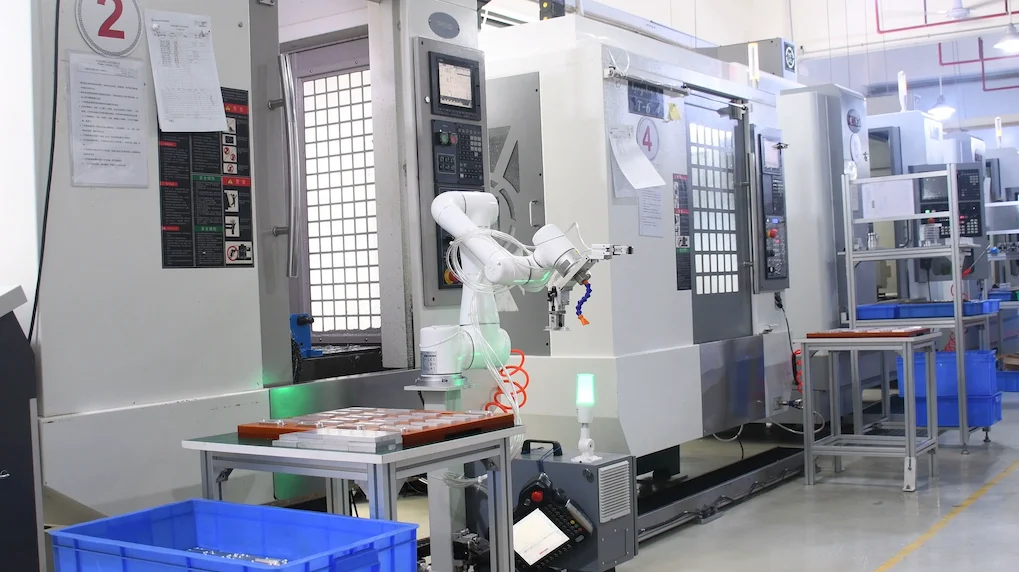 Robots are machining robotic components.